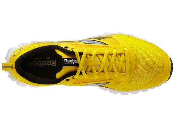 Aries Merritts Go-To Spikes: Blue and Yellow Reeboks for Speed
